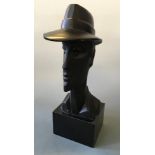 AUSTIN PROD. An Art Deco style black painted chalk male bust with hat mounted figurine, date 1988,
