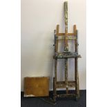 Two floor standing artist’s easels, a portable travelling artists box, etc.