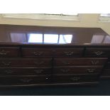 Two reproduction bedroom chests with matching mirror.