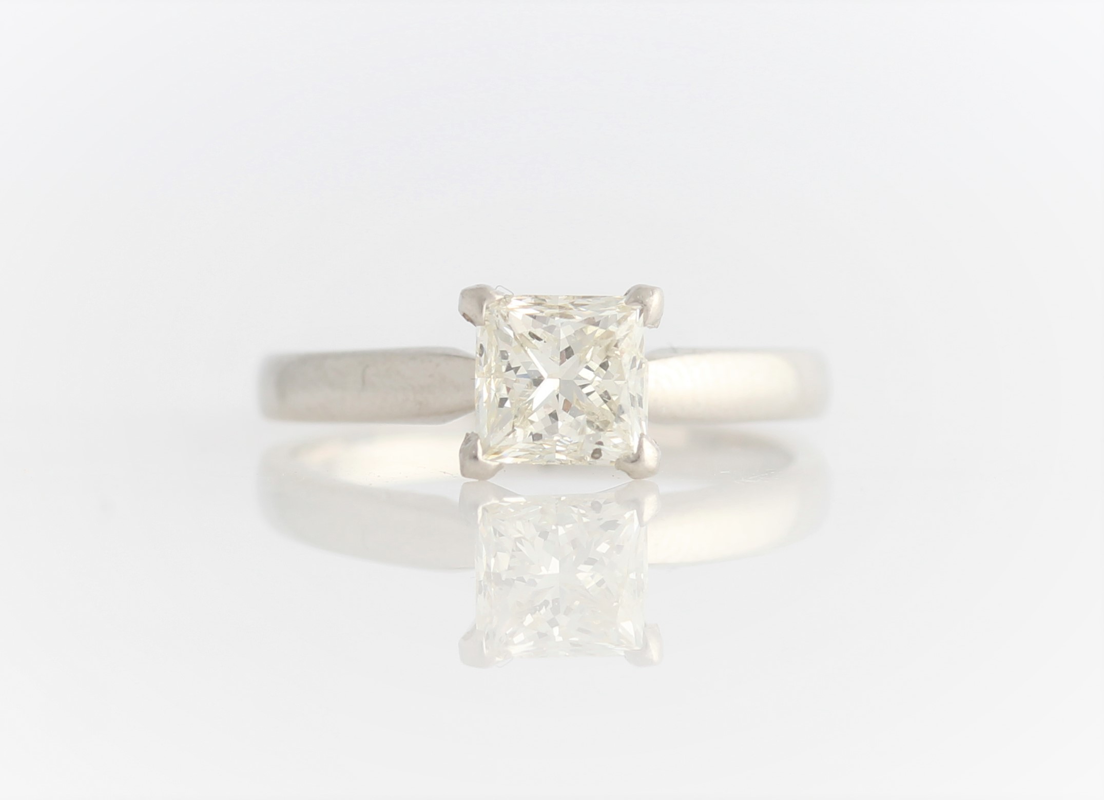 A hallmarked platinum diamond solitaire ring, set with a princess cut diamond measuring approx. 1.