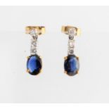 A pair of sapphire and diamond stud dropper earrings, each set with an oval cut sapphire,