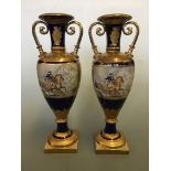 Two large Napoleonic style two handled vases depicting Napoleon on horseback, height 53cm.