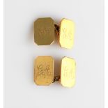A pair of hallmarked 9ct yellow gold monogrammed cufflinks.