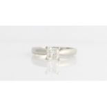 A platinum diamond solitaire ring, set with a princess cut diamond, measuring approx. 0.75ct,