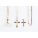 Three pendants and chains, two being cross pendants and one being a simulated pearl with cubic