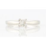 A hallmarked platinum diamond solitaire ring, set with a princess cut diamond measuring approx. 0.
