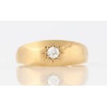 An early 20th Century 18ct yellow gold diamond solitaire ring, star set with an old cut diamond