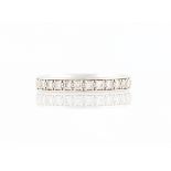 A platinum diamond half eternity ring, set with 21 round brilliant cut diamonds, total diamond