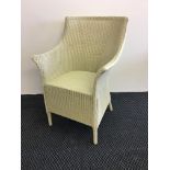 A white painted Lloyd loom chair.