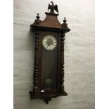 Two clocks, one walnut Vienna and one Tempus Fugit hall clock.