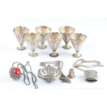 A collection to include, a Victorian silver vesta case hallmarked Birmingham 1894, six white metal