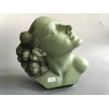 SALVATORE MELANI. An Art Deco green painted bust of female, marked 92, Deposé, height 36cm, width