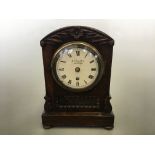 A J Charlton London small bracket clock in rosewood case with a subtle fused movement, with leaf and