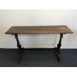 One mahogany topped cast iron based oblong pub table.