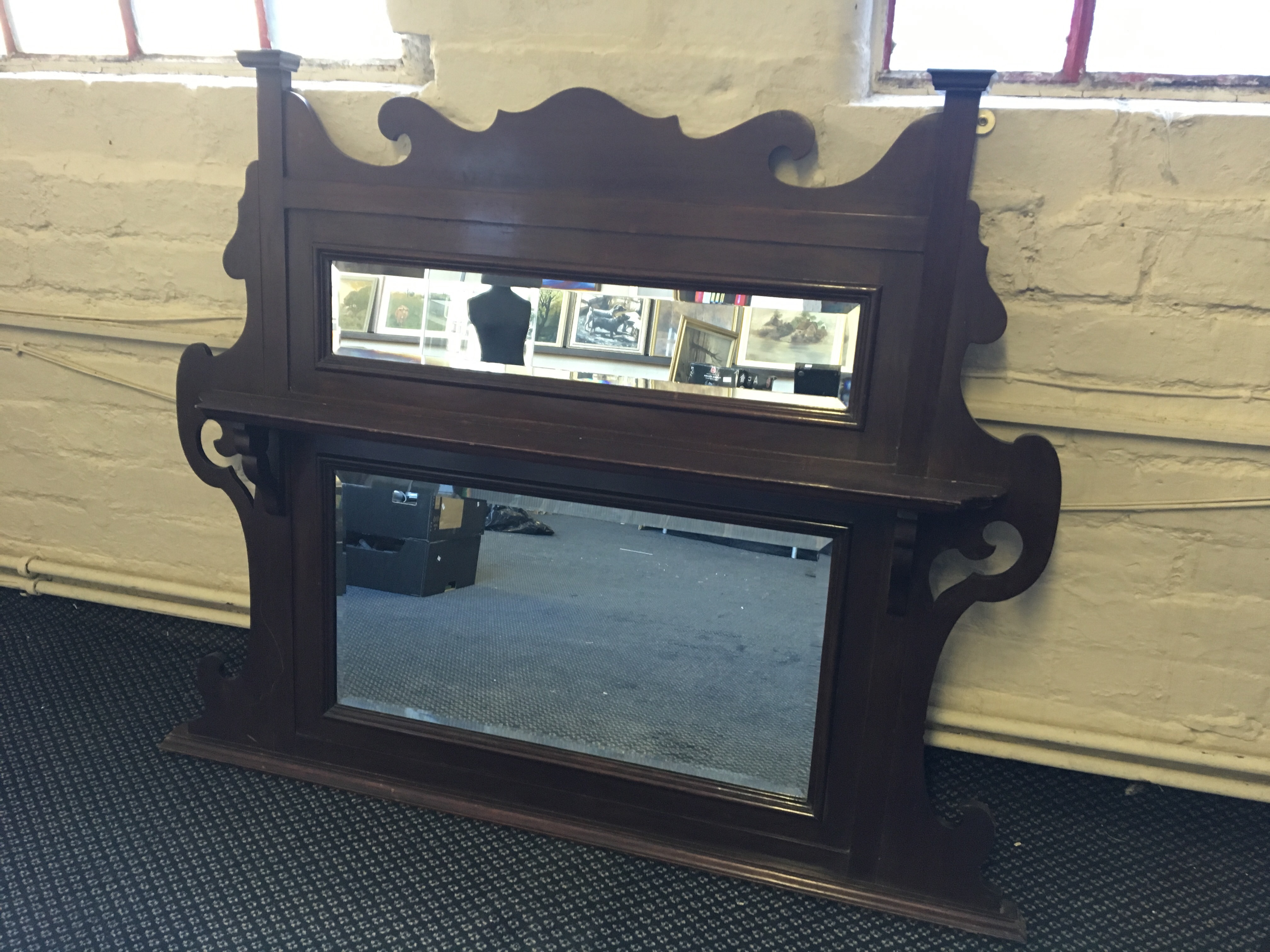 A mahogany double mirrored over mantle.
