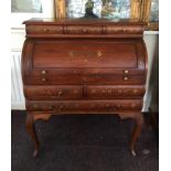 A mahogany reproduction brass inlay bureau with cylinder top.