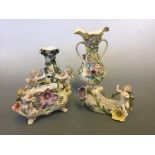A collection of various vases with cherub and floral decoration.