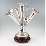 A late 19th Century Chinese export silver epergne, having central flute surrounded by three