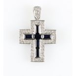 A hallmarked 18ct white gold sapphire and diamond cross pendant, set with six baguette cut sapphires