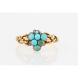 A turquoise ring, set with reconstituted turquoise cabochons in grape design with open metalwork