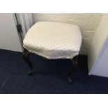 A walnut cream upholstered stool on cabriole legs.