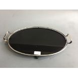 An Art Deco chrome and black vitrolite oval tray, 29cm x 42cm.