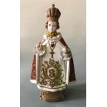 A painted chalk sculpture of Infant Jesus of Prague, height 54cm.