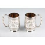 A pair of late 19th Century Chinese export silver tankards by Cumshing, both engraved with bird