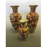 Three Japanese satsuma style vases with two Linda June Smith prints.