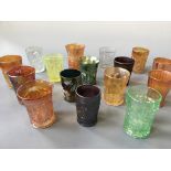 Sixteen carnival glass tumblers, including star medallion, tiger lily, grape vine, Spring