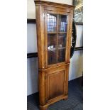 A Victorian distressed glazed oak corner cabinet.