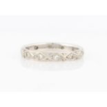 A hallmarked 18ct white gold diamond full eternity ring, set with eight cut diamonds, ring size M.