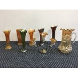 A selection of carnival glassware, a tree trunk vase, rustic vase, Imperial ripple vase, sunflower