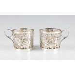 A pair of late 19th/early 20th Century Chinese export silver glass lined tea cups, the pierced