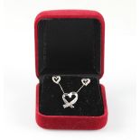 A part suite of diamond set heart jewellery, comprising a hallmarked 9ct white gold pendant, on a