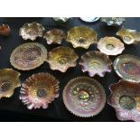 A selection of carnival glassware, including eight ruffled bowls in varying patterns such as