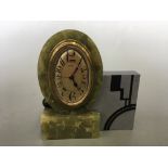 A French made Art Deco onyx and marble mantel clock DEP, in oval and square form, 15cm x 14cm x