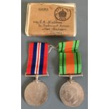 World War Two Defence and Victory medals belonging to E.F. Wallace, with postage box.