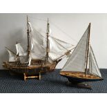 A model galleon together with a pond yacht.
