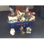 Two boxes of die cast cars, bird figurines and bird ornaments.