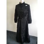 A Victorian dress with buttons to skirt, together with three underskirts.