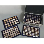 Large collection of silver commemorative coins in aluminium case.