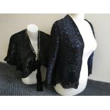 A black ladies lace jacket, together with a green silk shawl and two other shawls.