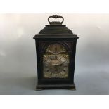 A George I bracket clock in ebonised case by Quare and Horseman London, with four glazed