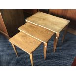 A nest of Gordon Russell walnut graduated coffee tables.