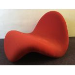 A Pierre Paulin red tongue chair.