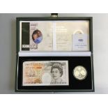 The Royal Mint Golden Wedding Anniversary ten pounds and silver proof coin set.