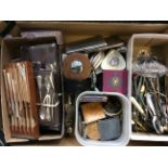 Four boxes of various items to include glassware and cutlery