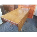 Early 19th century mahogany drop leaf table with single drawer.