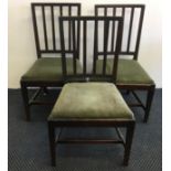 Six mahogany 19th Century green velvet upholstered dining chairs.